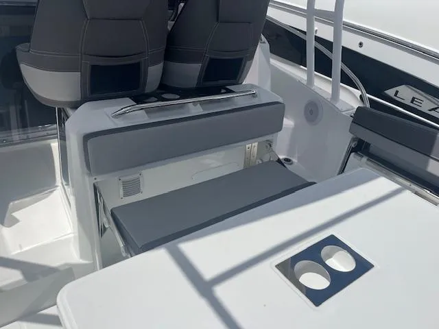 Slide: The Image of Interior seating and table of 2024 Jeanneau Leader 9.0 WA boat. - 2