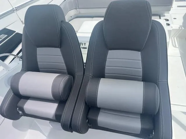 Slide: The Image of 2024 Jeanneau Leader 9.0 WA boat seats, black and gray upholstery. - 4