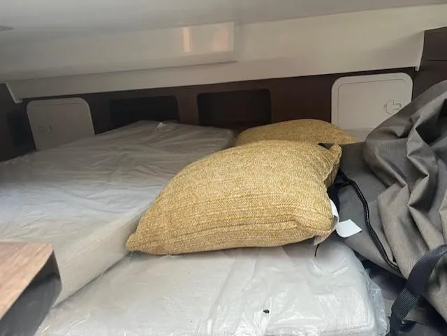 Slide: The Image of Interior cabin of 2024 Jeanneau Leader 9.0 WA with bedding and pillows. - 7