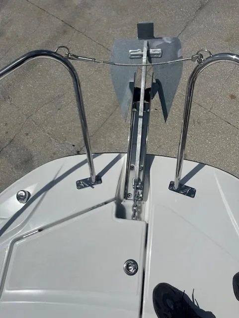 Slide: The Image of 2024 Jeanneau Leader 9.0 WA bow with anchor and stainless steel railings. - 9