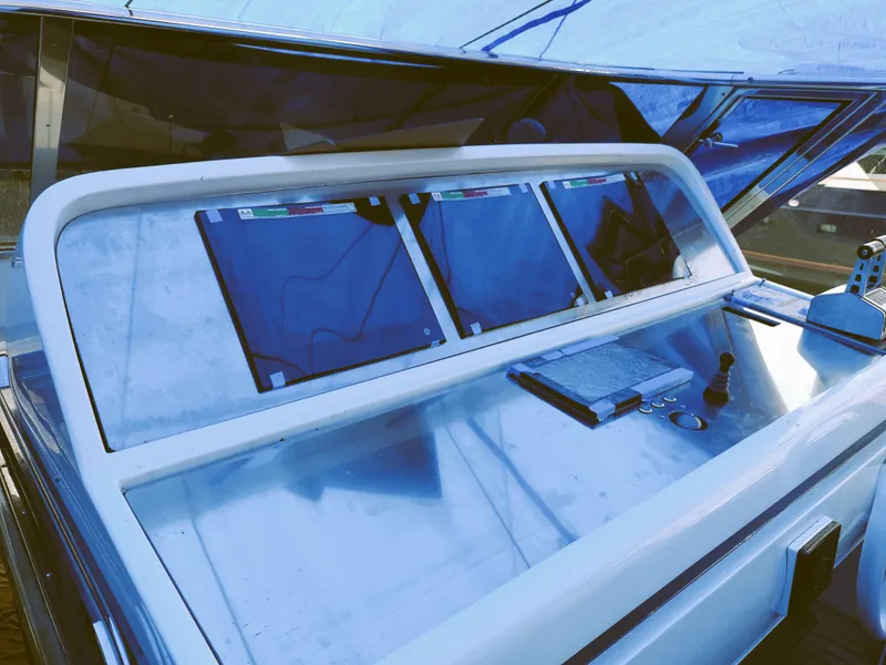 Slide: The Image of Control panel of a 1995 Mangusta Motor Yacht with navigation screens and instruments. - 18