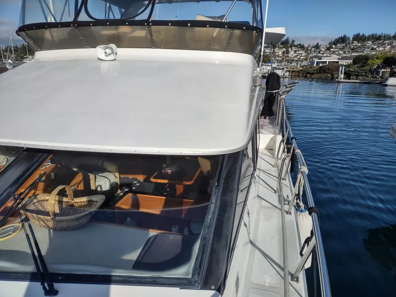 Slide: The Image of 1989 Ocean Alexander 440 CPMY yacht docked at a marina. - 11