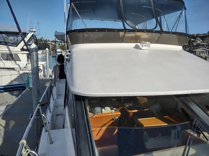 Slide: The Image of 1989 Ocean Alexander 440 CPMY docked at a marina, side view. - 12