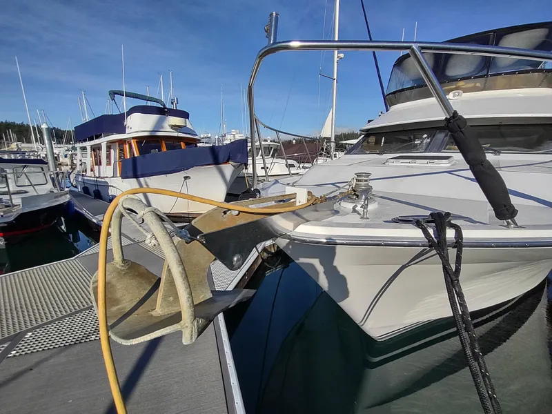 Slide: The Image of 1989 Ocean Alexander 440 CPMY yacht docked at a marina. - 15