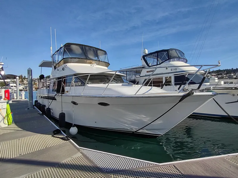 Slide: The Image of 1989 Ocean Alexander 440 CPMY yacht docked at marina. - 17