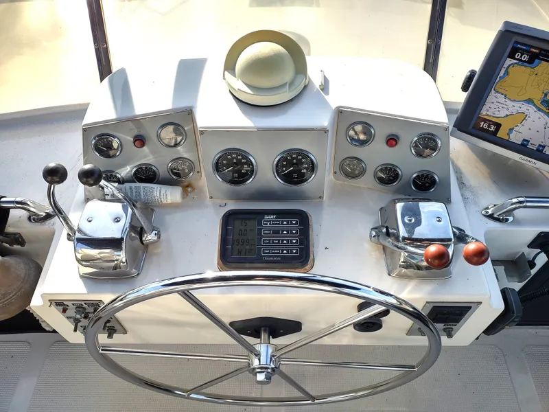 Slide: The Image of 1989 Ocean Alexander 440 CPMY helm with gauges, controls, and navigation equipment. - 31