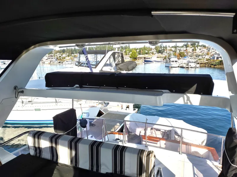 Slide: The Image of 1989 Ocean Alexander 440 CPMY yacht interior with marina view. - 40