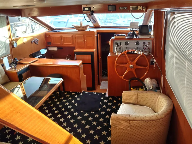 Slide: The Image of 1989 Ocean Alexander 440 CPMY yacht interior with wood finish and star-patterned carpet. - 43