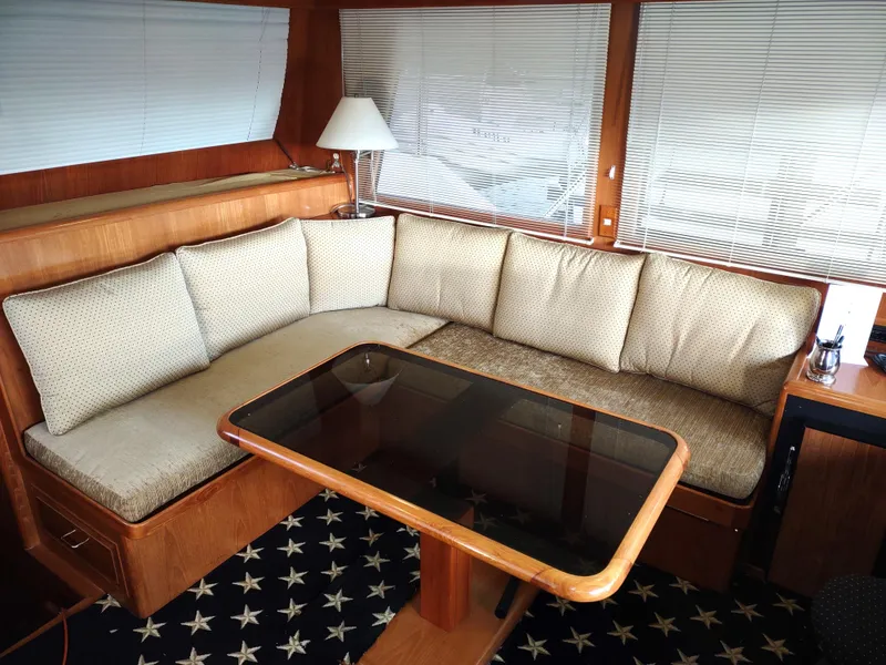 Slide: The Image of Luxurious 1989 Ocean Alexander 440 CPMY yacht interior with cozy seating and elegant table. - 48
