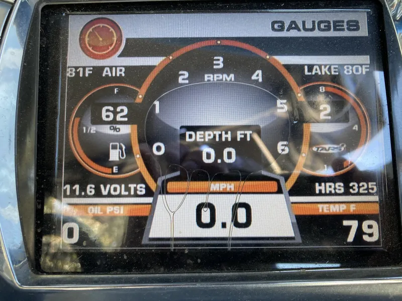 Slide: The Image of 2011 Tigé RZ2 boat dashboard displaying gauges and readings. - 6