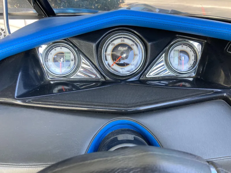 Slide: The Image of Dashboard of a 2011 Tigé RZ2 boat with speedometer and gauges. - 7