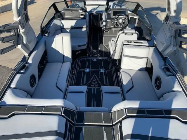 Slide: The Image of 2024 Supra SV 550 boat interior with luxurious seating and modern dashboard. - 10