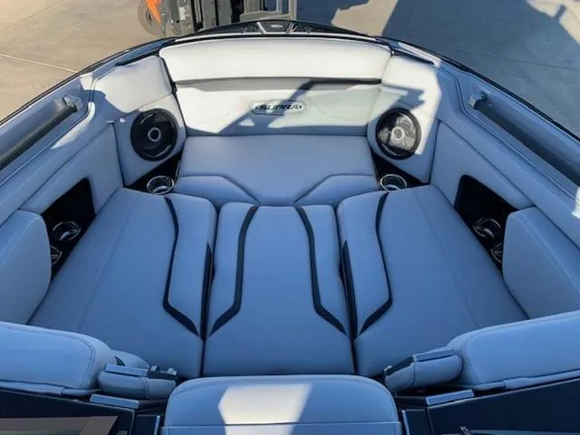 Slide: The Image of 2024 Supra SV 550 boat interior with luxurious seating and built-in speakers. - 11