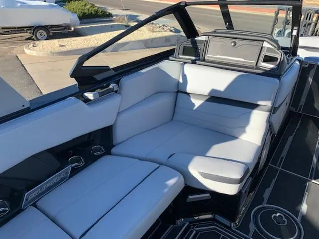 Slide: The Image of 2024 Supra SV 550 boat interior with white leather seating and modern design. - 14