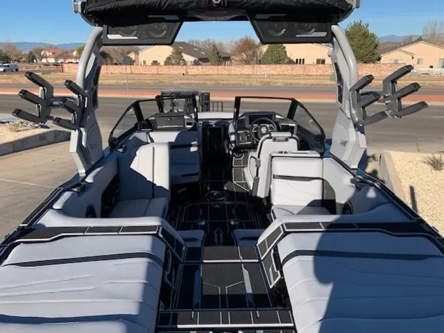 Slide: The Image of 2024 Supra SV 550 boat interior with modern seating and advanced dashboard. - 9