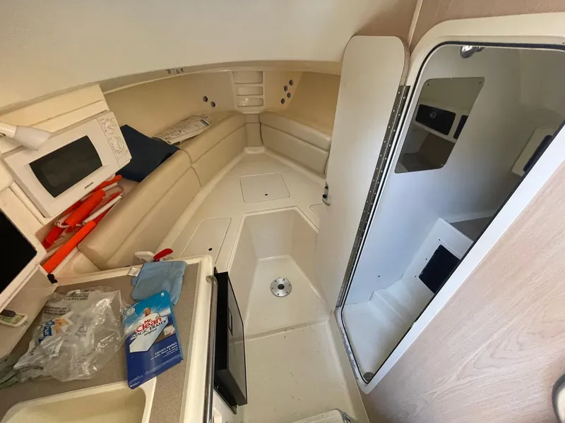 Slide: The Image of Interior of 2003 Scout 280 Abaco boat with seating and storage areas. - 17