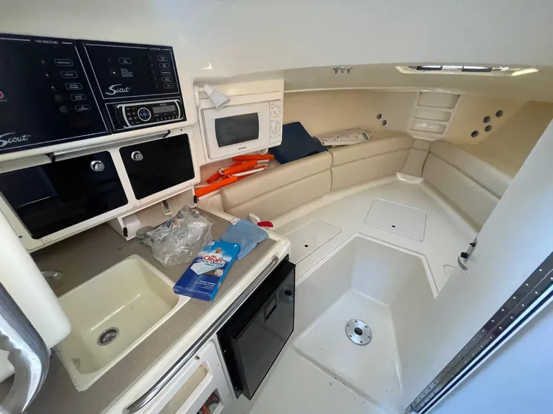 Slide: The Image of Interior of 2003 Scout 280 Abaco boat with kitchenette and seating area. - 18