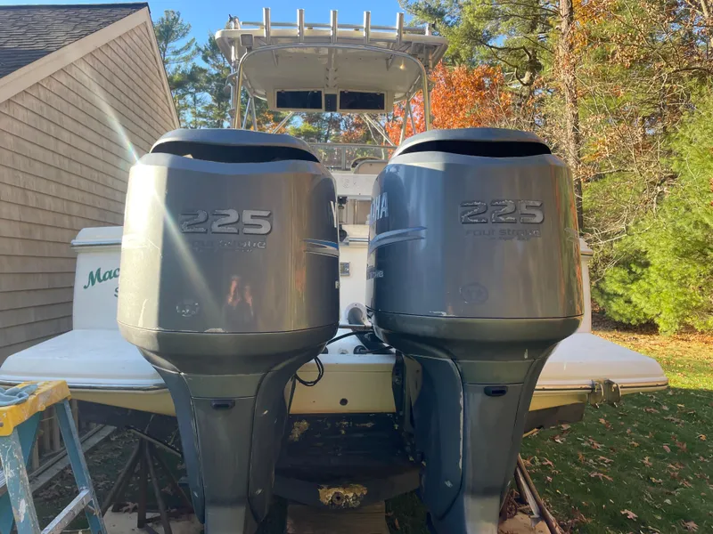 Slide: The Image of 2003 Scout 280 Abaco boat with twin Yamaha 225 engines, parked outdoors. - 6