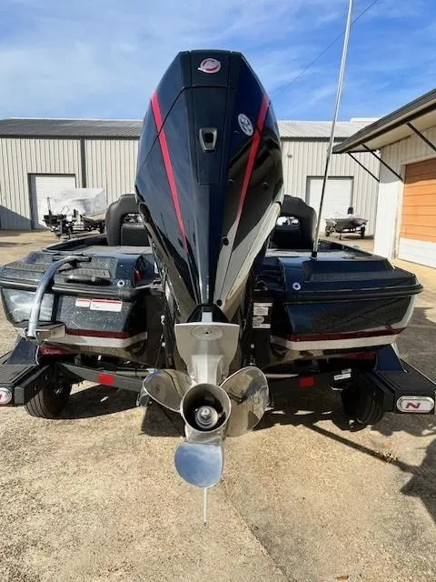 Slide: The Image of 2024 Nitro Z21 XL Pro boat rear view with powerful outboard motor. - 4