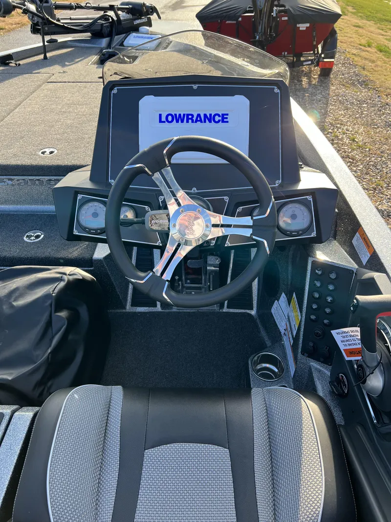 Slide: The Image of 2024 Ranger Z518 Ranger Cup Equipped boat dashboard with Lowrance display and steering wheel. - 8
