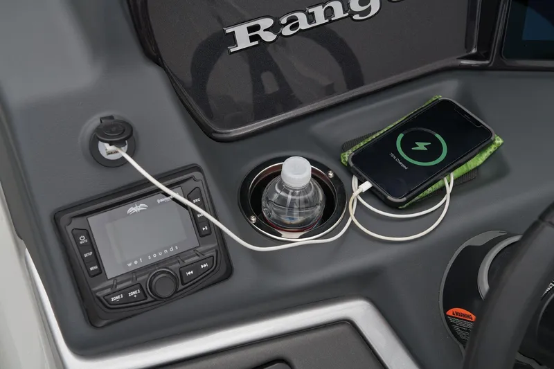 Slide: The Image of Control panel of 2024 Ranger Reata 243C with phone charging and water bottle. - 38
