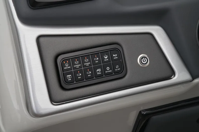 Slide: The Image of Control panel of 2024 Ranger Reata 243C boat with various function buttons. - 40