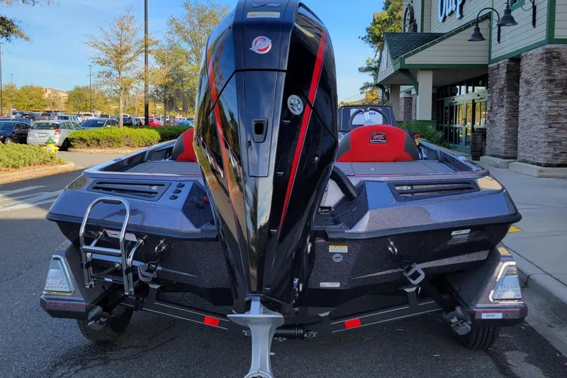 Slide: The Image of 2024 Ranger Z519 Ranger Cup Equipped boat, rear view in parking lot. - 3
