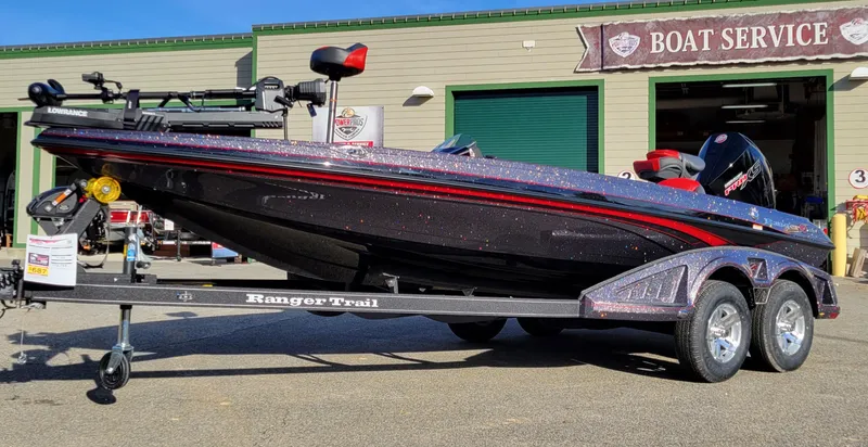 Slide: The Image of 2024 Ranger Z519 Ranger Cup Equipped boat on trailer outside boat service shop. - 4