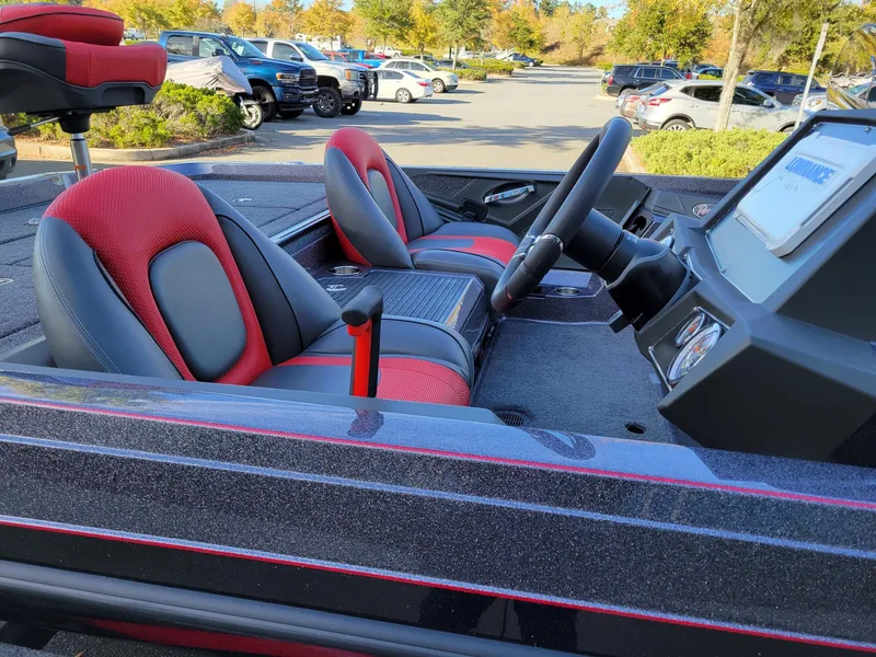 Slide: The Image of 2024 Ranger Z519 Ranger Cup Equipped boat interior with red and black seats. - 6