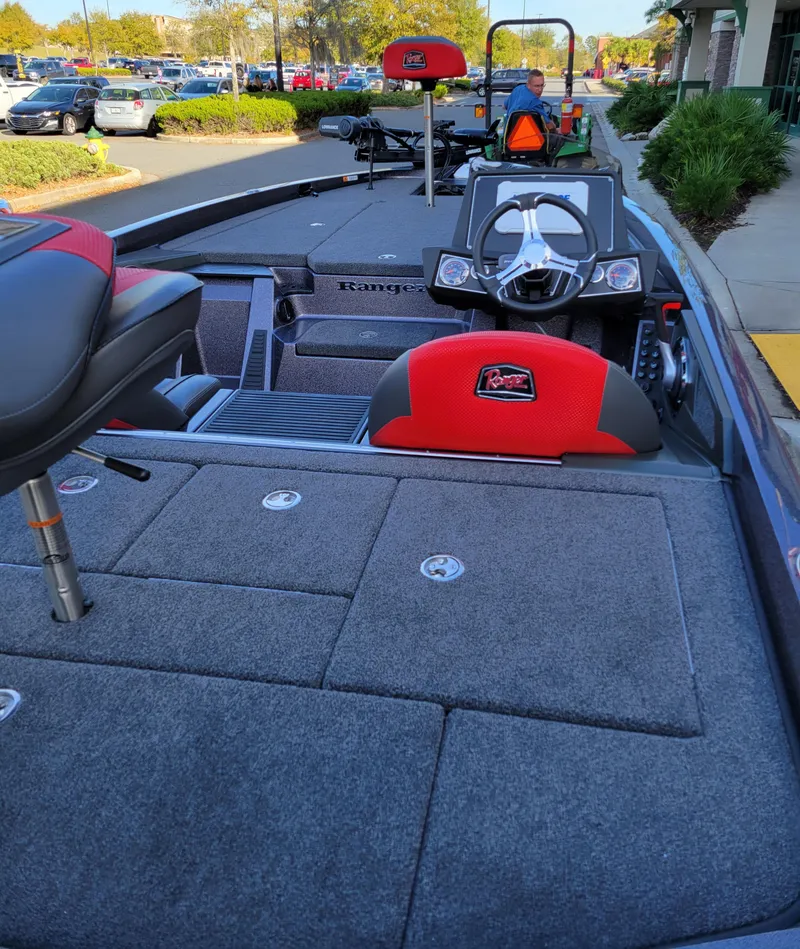 Slide: The Image of 2024 Ranger Z519 Ranger Cup Equipped boat interior with steering wheel and seating. - 7
