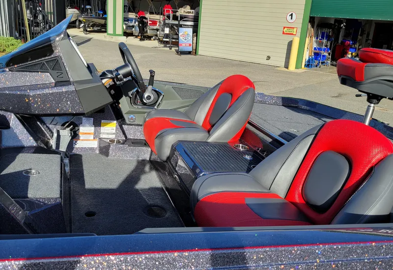 Slide: The Image of 2024 Ranger Z519 Ranger Cup Equipped boat interior with red and gray seats. - 8