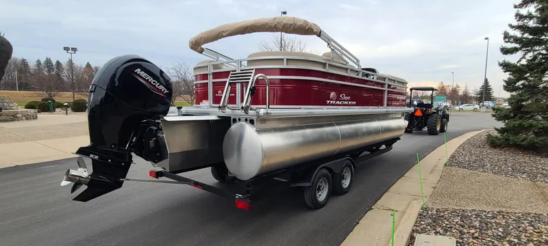 Slide: The Image of 2024 Sun Tracker Party Barge 22 XP3 pontoon boat on trailer. - 4