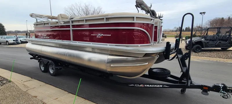 Slide: The Image of 2024 Sun Tracker Party Barge 22 XP3 pontoon boat on a trailer. - 6