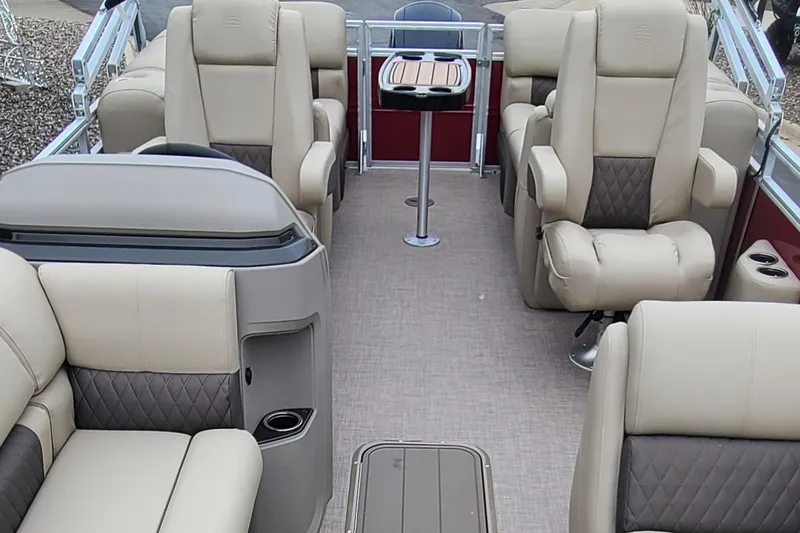 Slide: The Image of 2024 Sun Tracker Party Barge 22 XP3 interior with luxurious seating and table. - 8