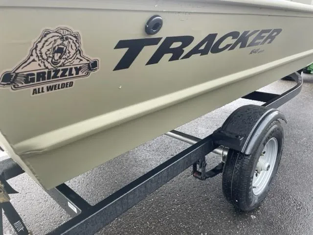 Slide: The Image of 2024 Tracker Grizzly 1648 SC boat on trailer, close-up view. - 5