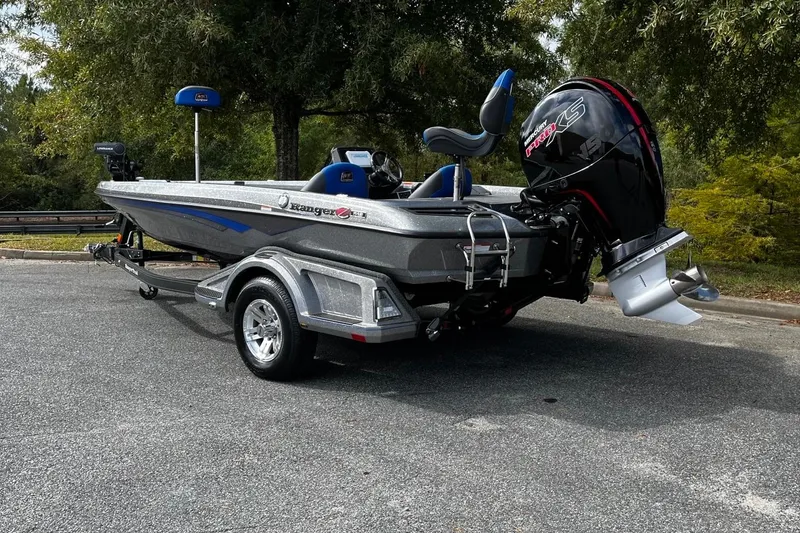 Slide: The Image of 2024 Ranger Z518 Ranger Cup Equipped boat on trailer, parked outdoors. - 3