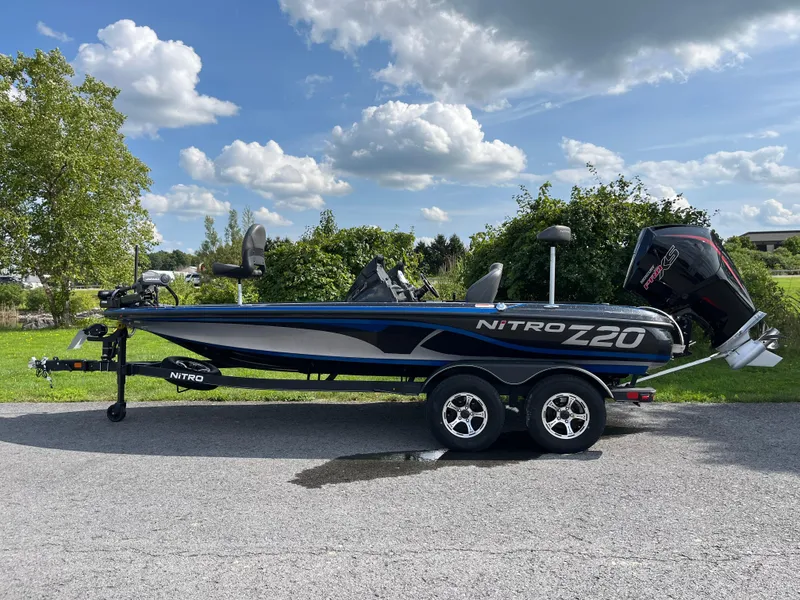 Slide: The Image of 2024 Nitro Z20 Pro boat parked on a sunny day with blue skies. - 0