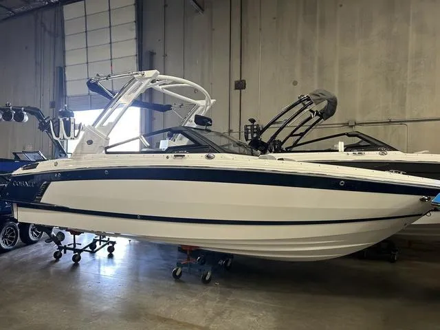 Slide: The Image of 2024 Cobalt R4 Surf boat in a warehouse setting. - 1