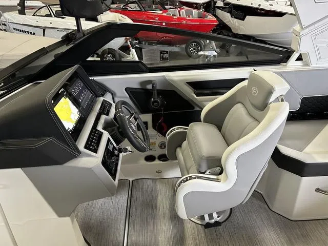 Slide: The Image of 2024 Cobalt R4 Surf boat interior with modern dashboard and comfortable captain's chair. - 5