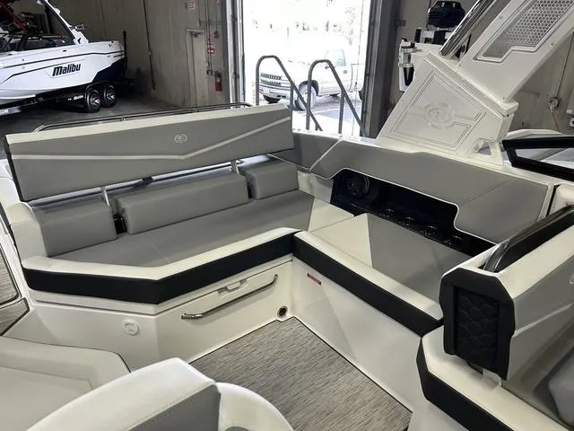 Slide: The Image of 2024 Cobalt R4 Surf boat interior with sleek gray seating and modern design. - 7