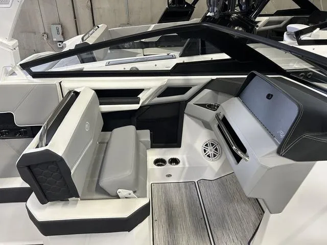 Slide: The Image of 2024 Cobalt R4 Surf boat interior with sleek seating and modern design. - 8