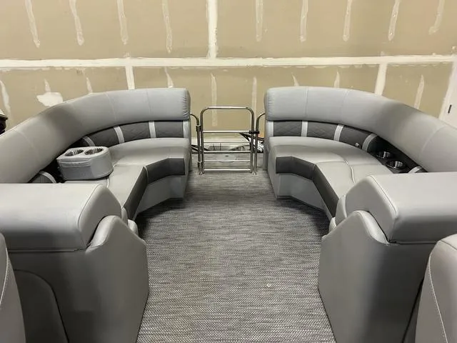 Slide: The Image of 2024 Bennington 23 LFB boat interior with gray seating and cup holders. - 6