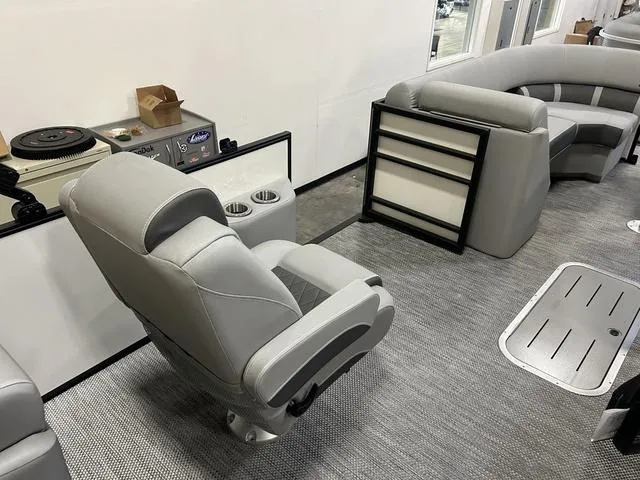 Slide: The Image of Interior of 2024 Bennington 23 LFB boat with gray seating and modern amenities. - 7