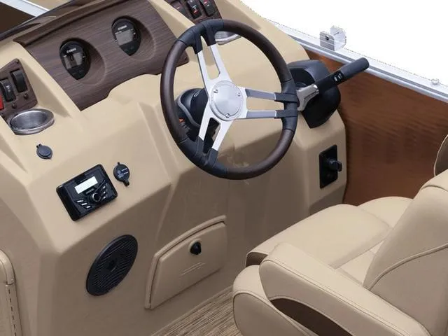 The Image of 2024 Bennington 22 SS boat dashboard with steering wheel and controls. - 1