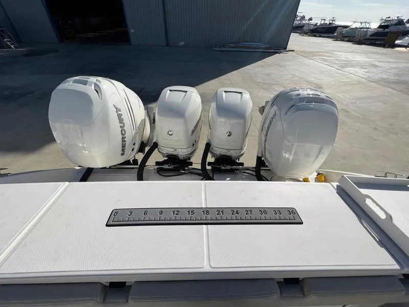 Slide: The Image of 2022 Solace 41 CS boat with triple Mercury outboard engines. - 12