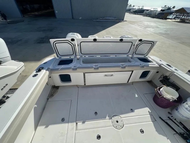Slide: The Image of 2022 Solace 41 CS boat deck with open storage compartments. - 13
