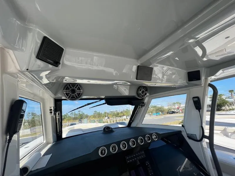 Slide: The Image of Interior view of 2022 Solace 41 CS boat cockpit with modern dashboard and speakers. - 18