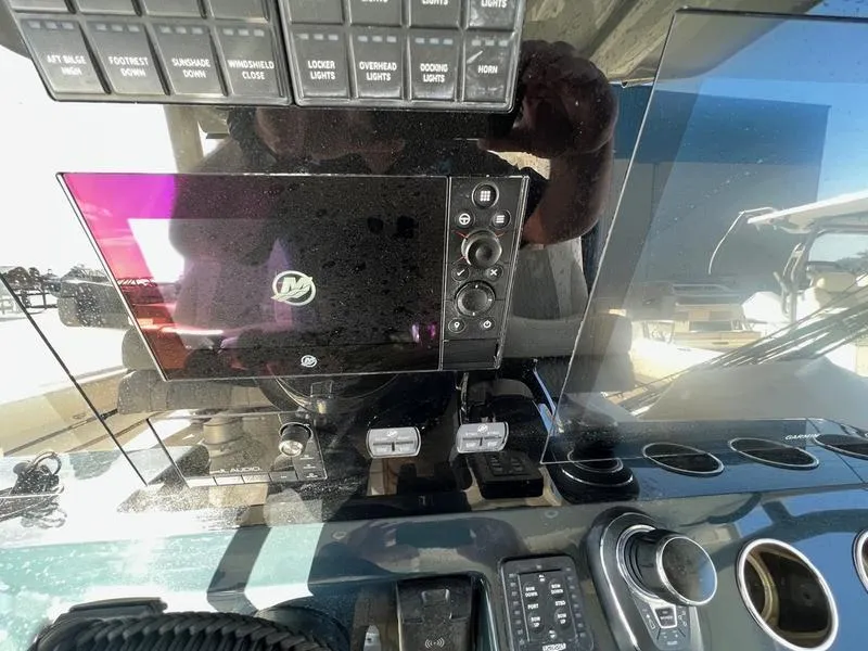 Slide: The Image of Dashboard of 2022 Solace 41 CS boat with control panel and display screen. - 21