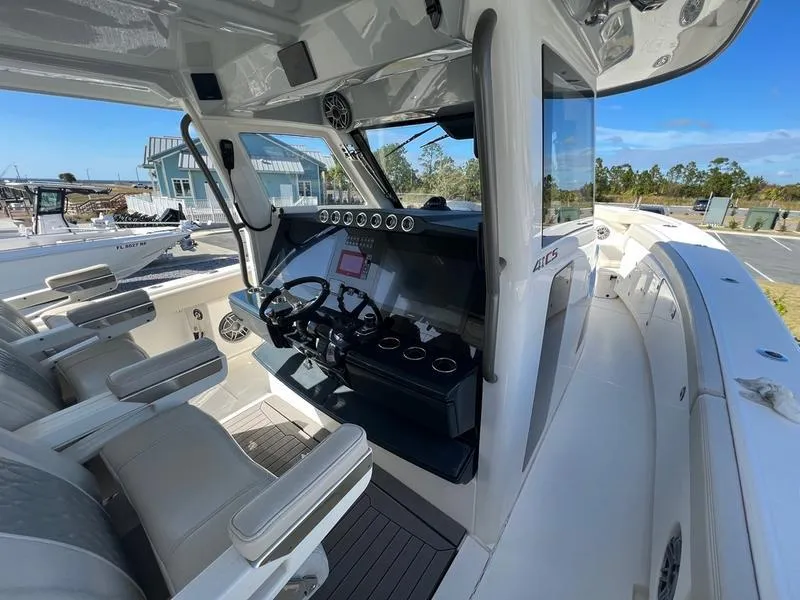 Slide: The Image of 2022 Solace 41 CS boat interior with modern helm and seating. - 24