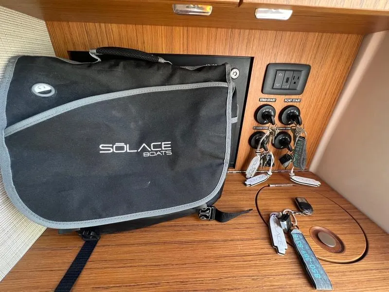 Slide: The Image of Solace 41 CS boat interior with branded bag and key panel, 2022 model. - 29